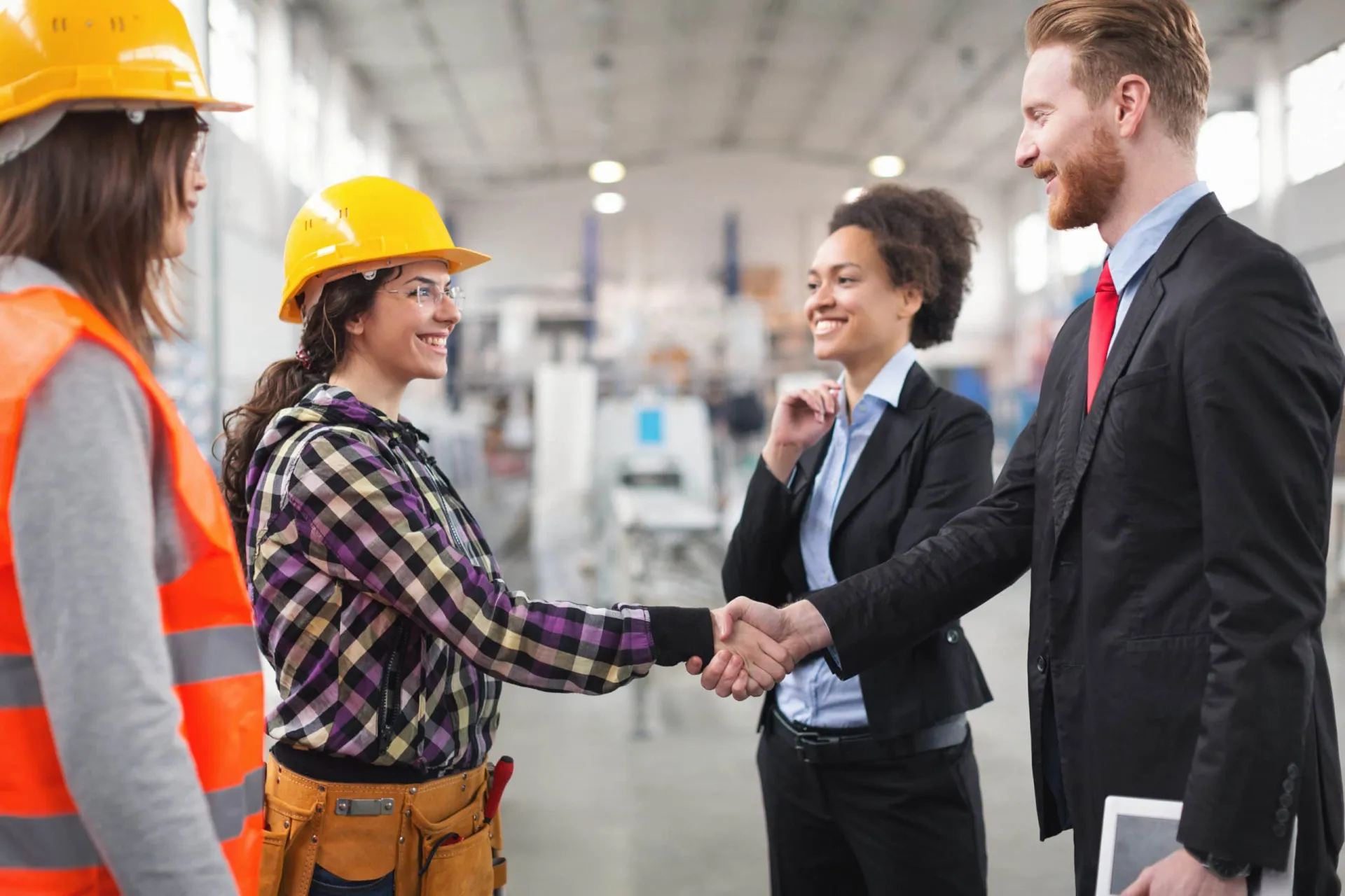Customer engagement and professional handshake in industrial setting. Customer engagement and professional handshake in industrial setting.