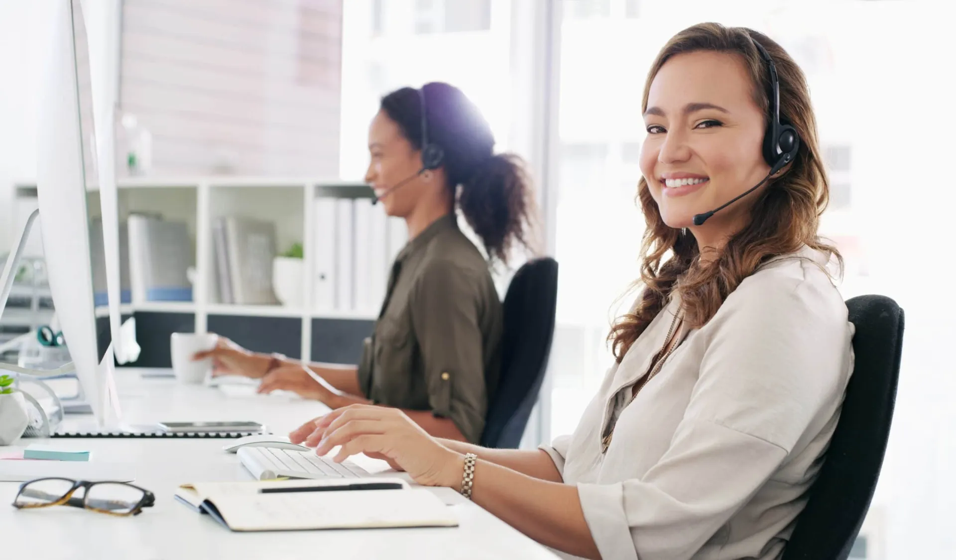 Customer Service Call Center Agents Supporting Marketing Teams Call center agents providing support for marketing teams with customer service solutions.