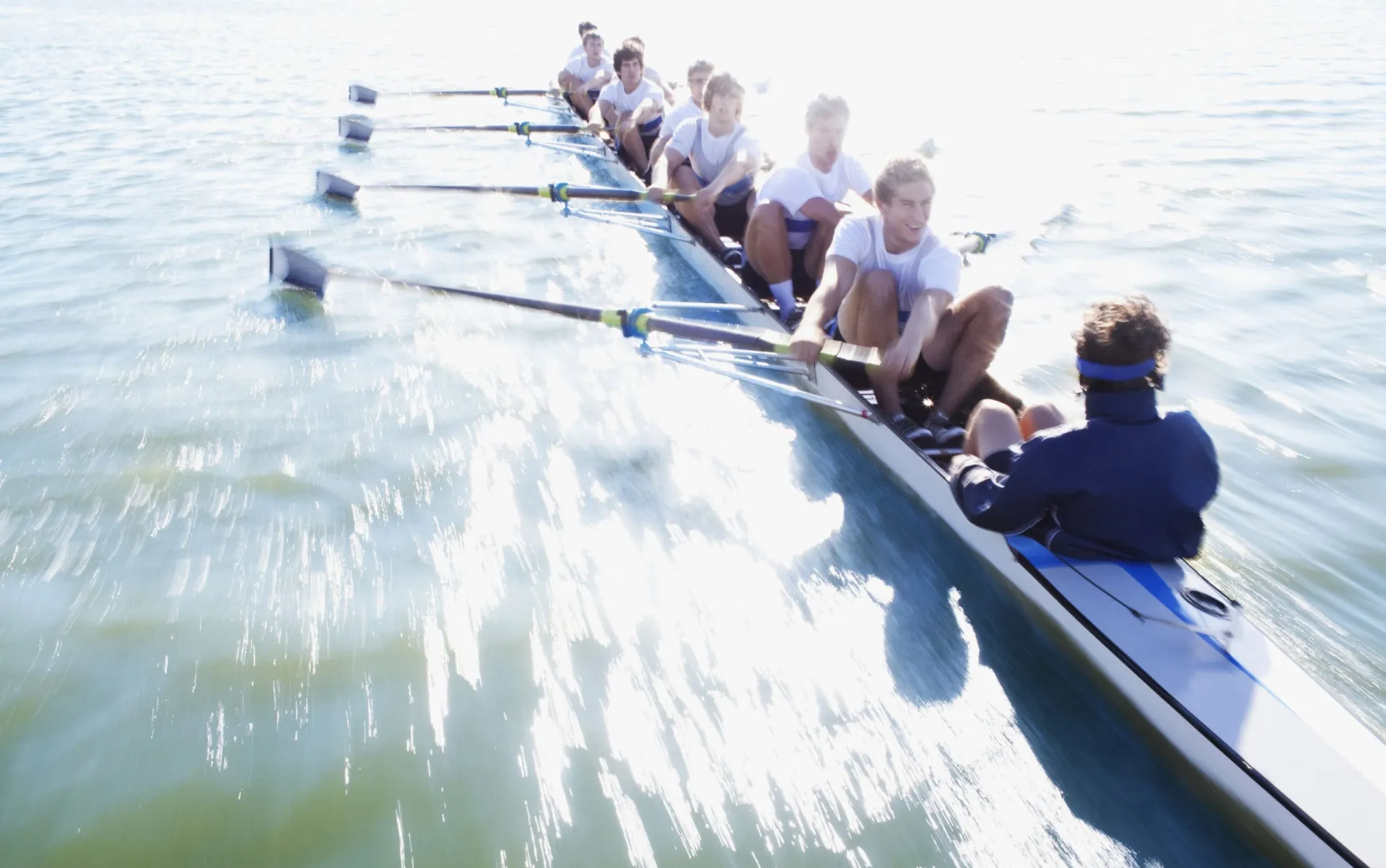 Team rowing a boat for teamwork and collaboration in business. Team rowing a boat emphasizing teamwork, collaboration, and strategic effort.