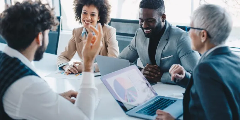 Business team discussing lead generation strategies in a modern office.