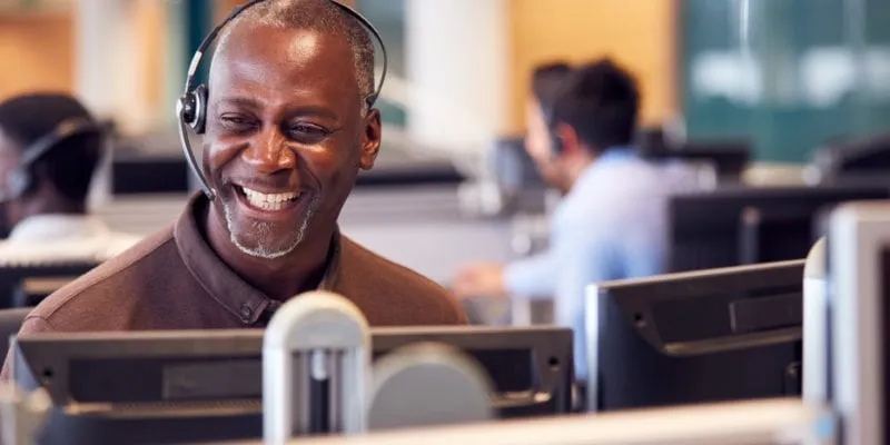 Customer service representative working in an inside sales call center environment.