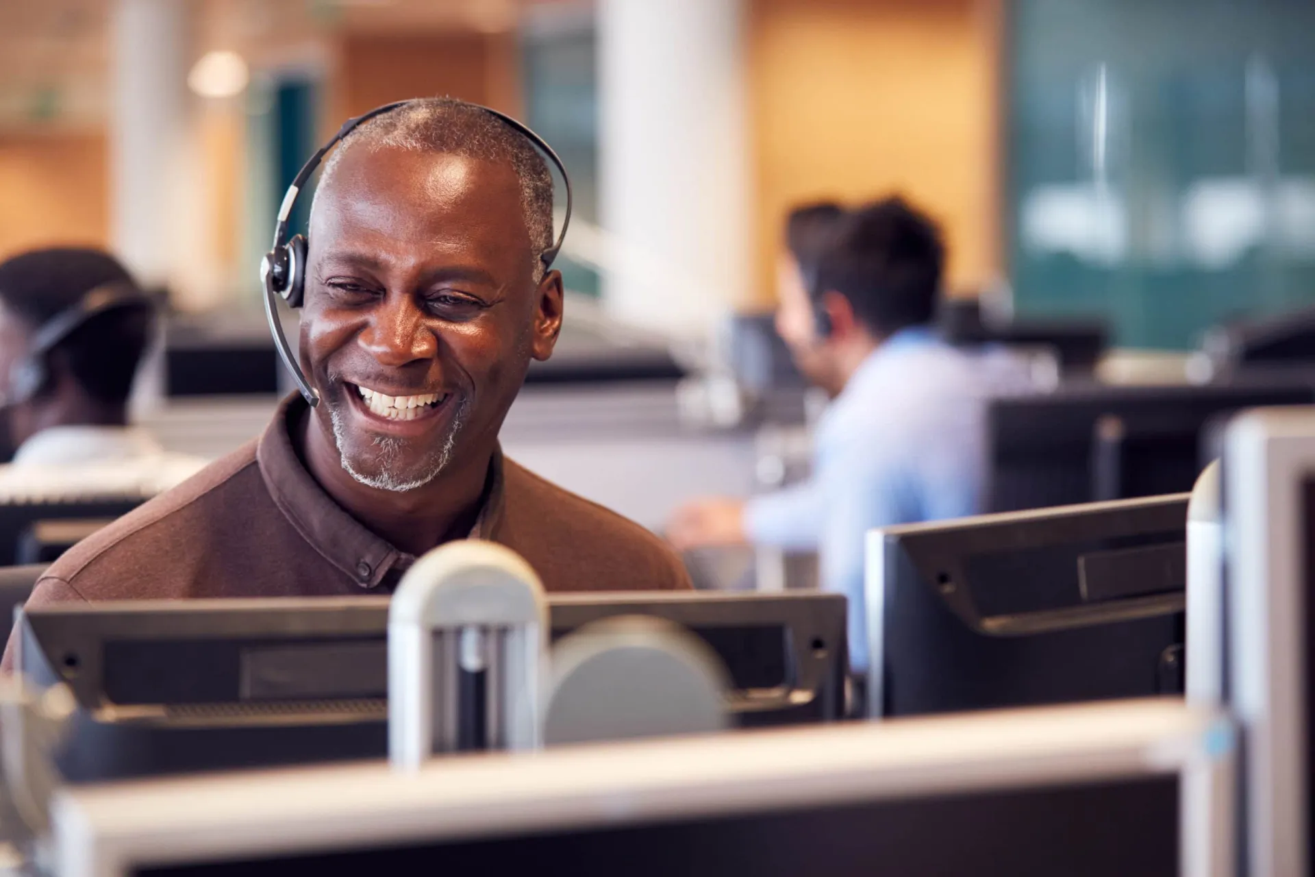 Customer service representative working in an inside sales call center environment. Customer service representative working in an inside sales call center environment.