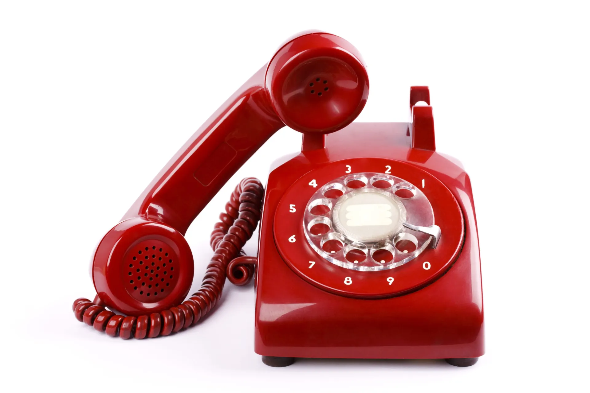 Red rotary telephone for business communication and sales calls. Red rotary telephone with classic design, symbolizing B2B sales calls and communication.