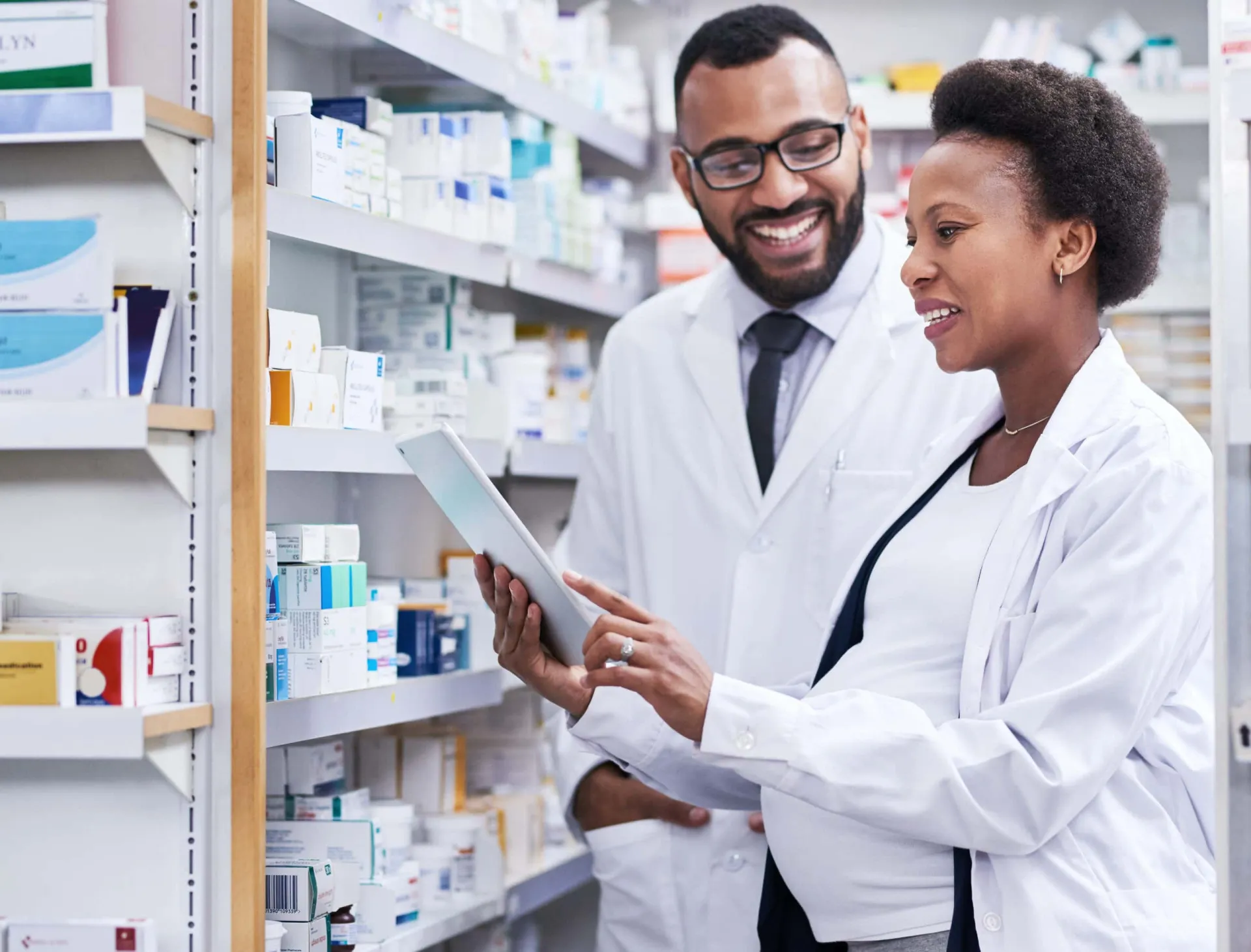 Healthcare industry case studies for lead generation for medical technology Medical professionals reviewing pharmaceutical products in pharmacy setting.