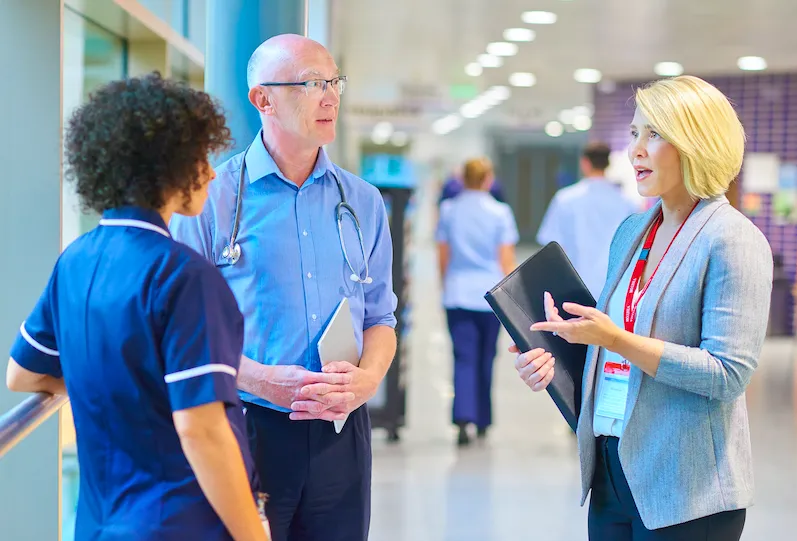 Effective Healthcare Sales Strategies Healthcare professionals discussing sales techniques in a hospital setting.