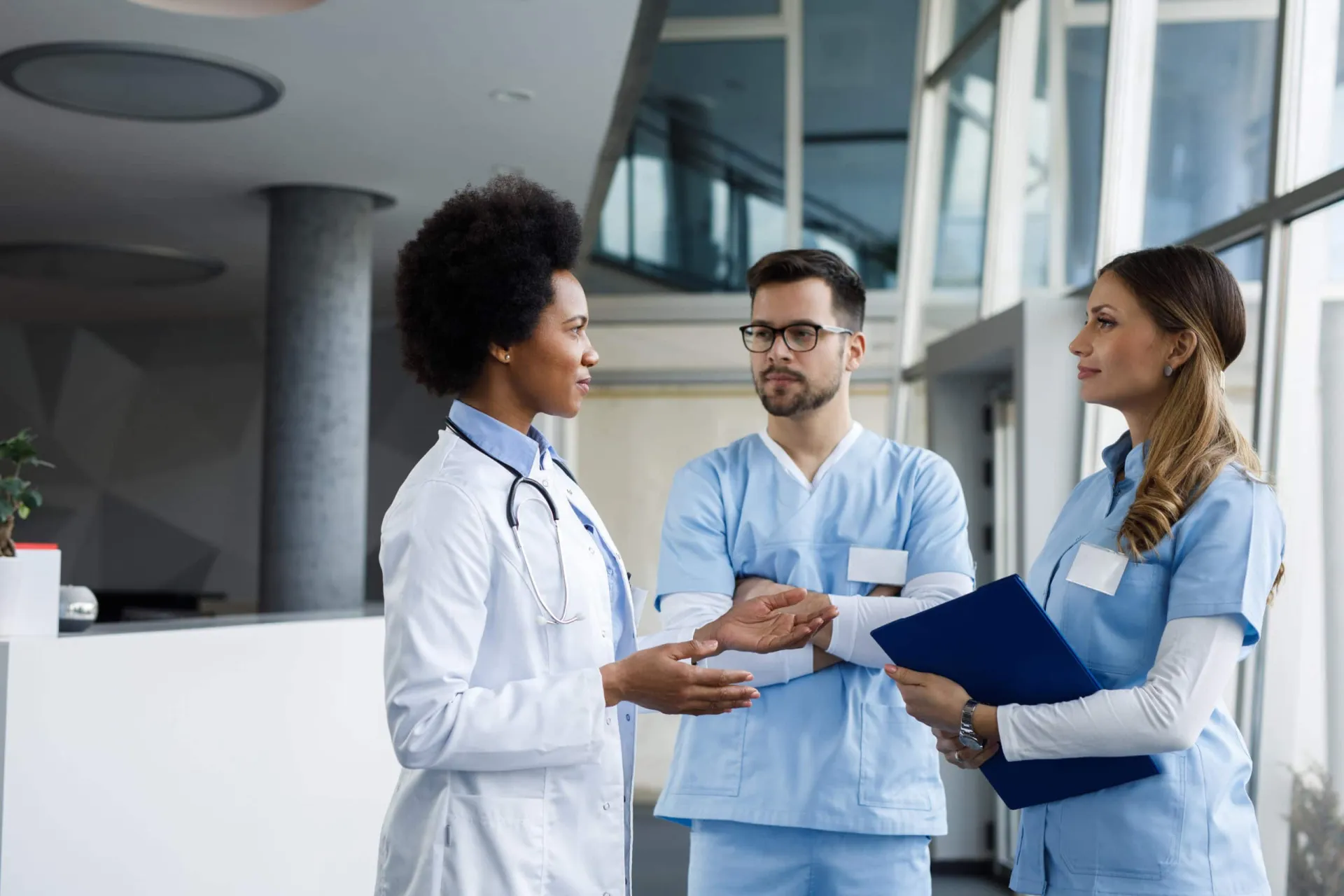 Building a Healthcare Prospect List Healthcare professionals discussing prospect strategies in a hospital setting.