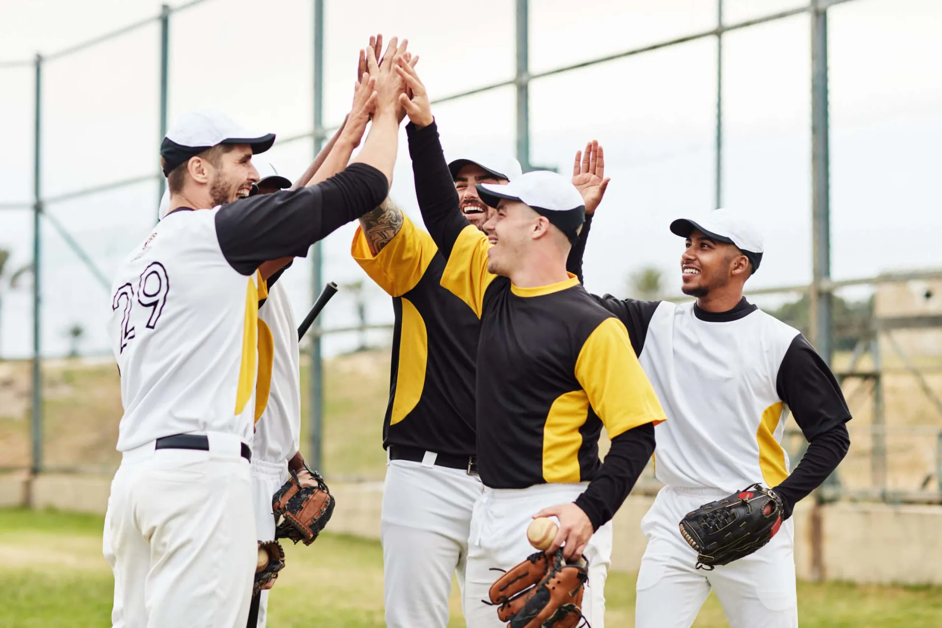 Team celebrating a successful game on the baseball field. High-energy team celebrating a home run in baseball.