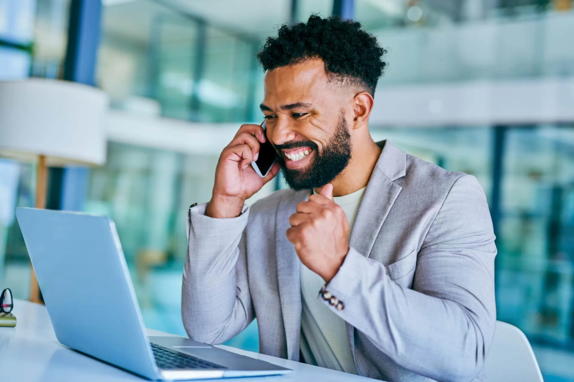 Effective Cold Calling Strategies Businessman making a successful cold call in modern office setting.