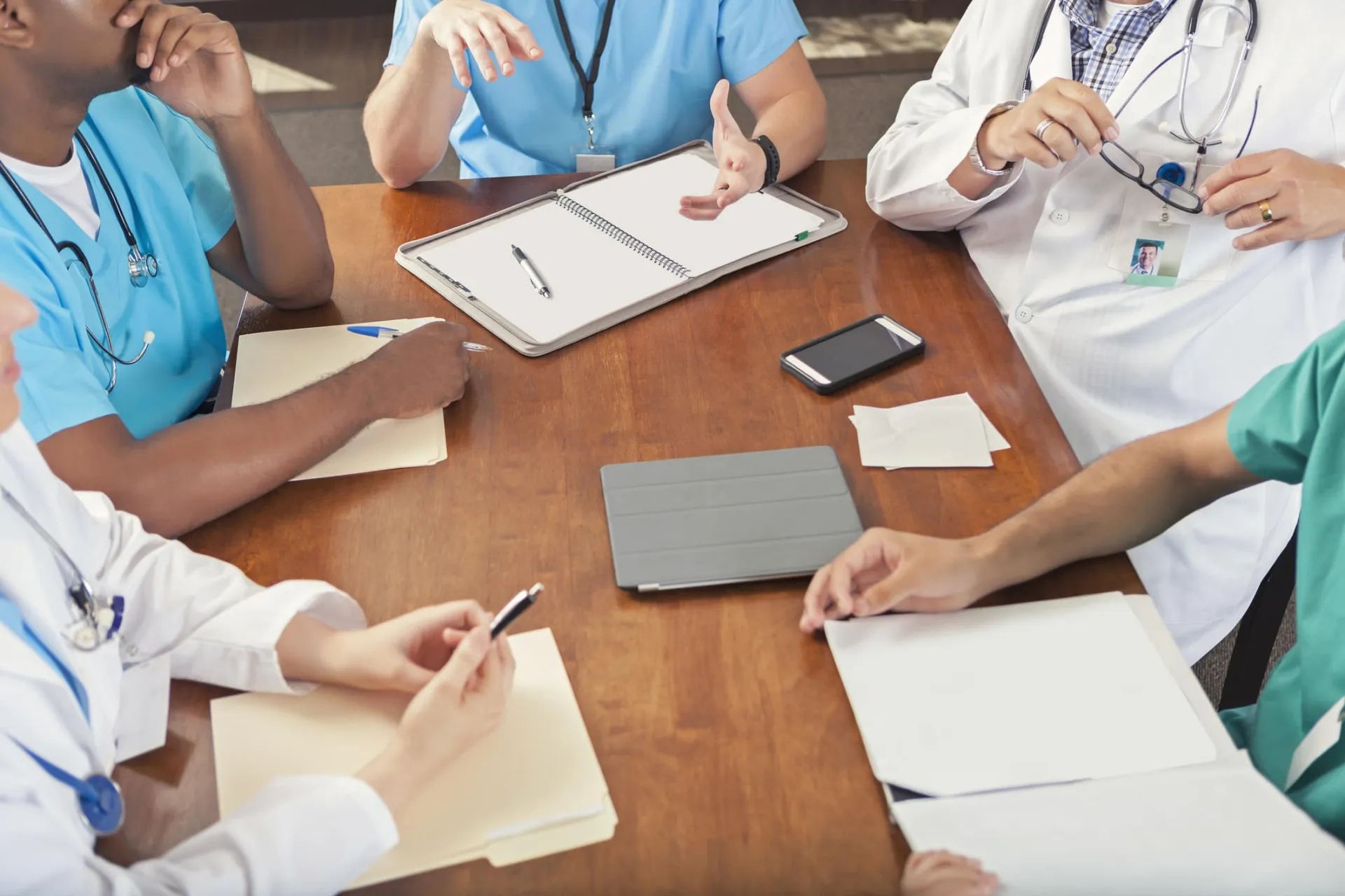 Innovative Medtech Sales Strategies Medical team discussing sales growth strategies in a hospital meeting.