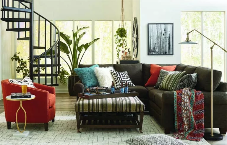 spiral staircase living room deep green sofa orange statement chair