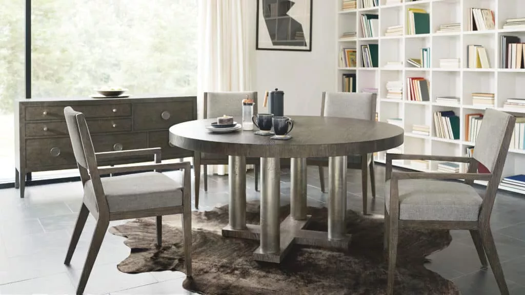 A Bernhardt dark gray stone dining set with four chairs