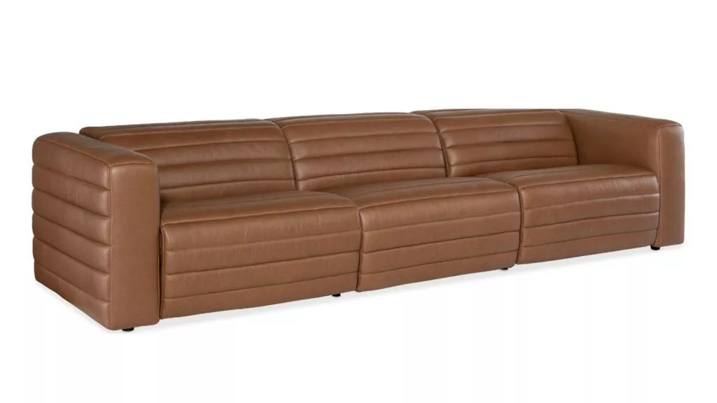 A three piece brown leather sofa with a bubbled texture