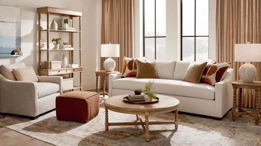 A Bassett living room scene with a couch, arm chair, and coffee table
